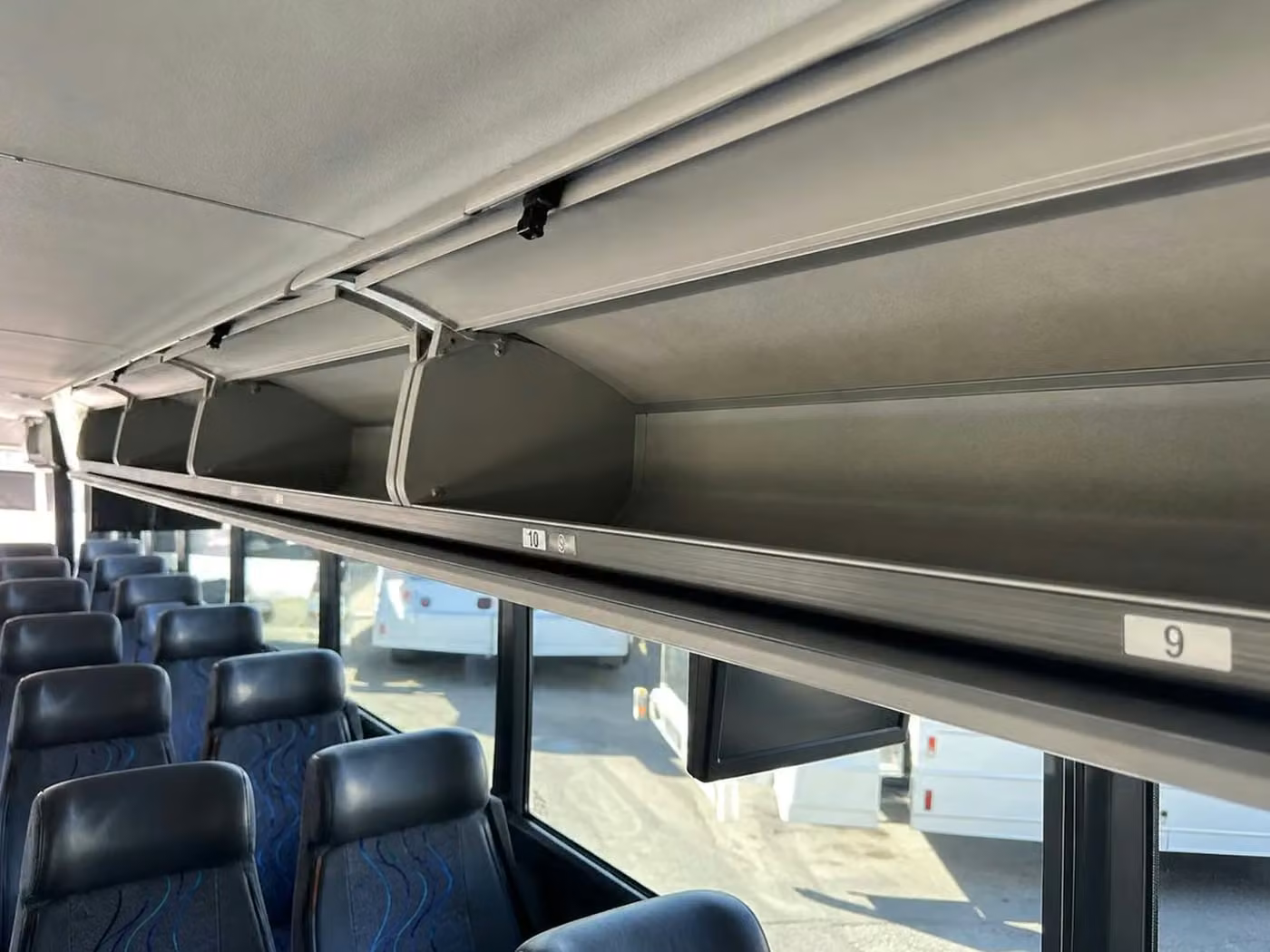 estero 25 passenger minibus overhead storage