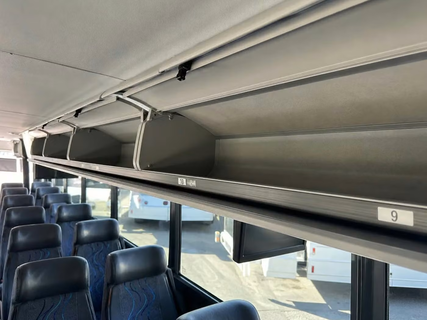 estero 56 passenger charter bus overhead storage
