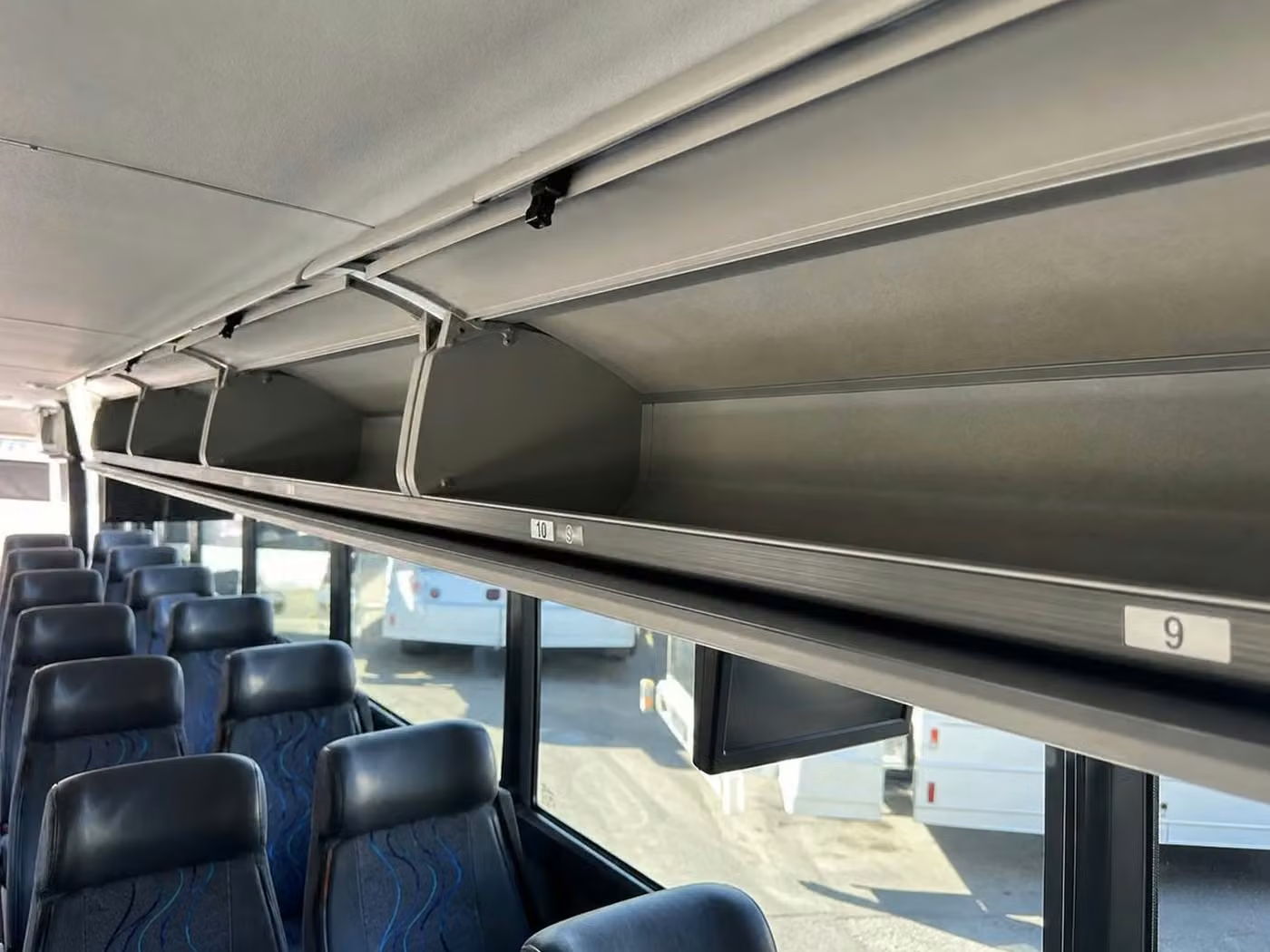 estero charter bus overhead storage